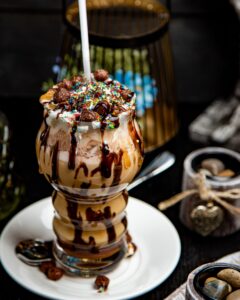 Chocolate Latte Topped with Caramel and Candies